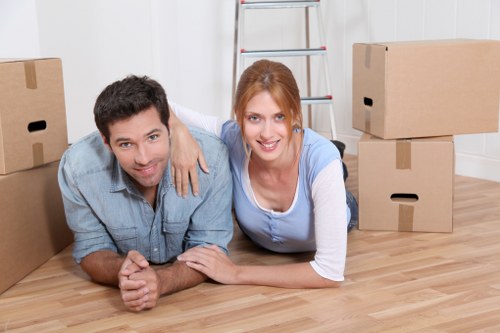 Family organizing boxes for mobile self storage in Leyton