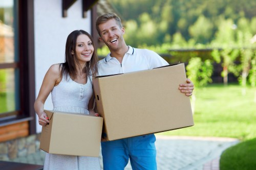 Professional movers packing household items for a local removal in Leyton