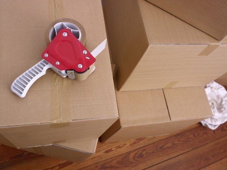 Organised storage unit with boxes and furniture in Leyton